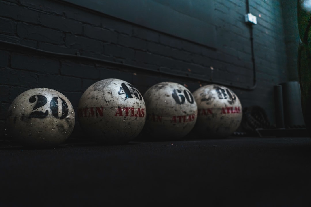 A collection of Atlas Stones, resting in their natural habitat, the strongman training ground.
