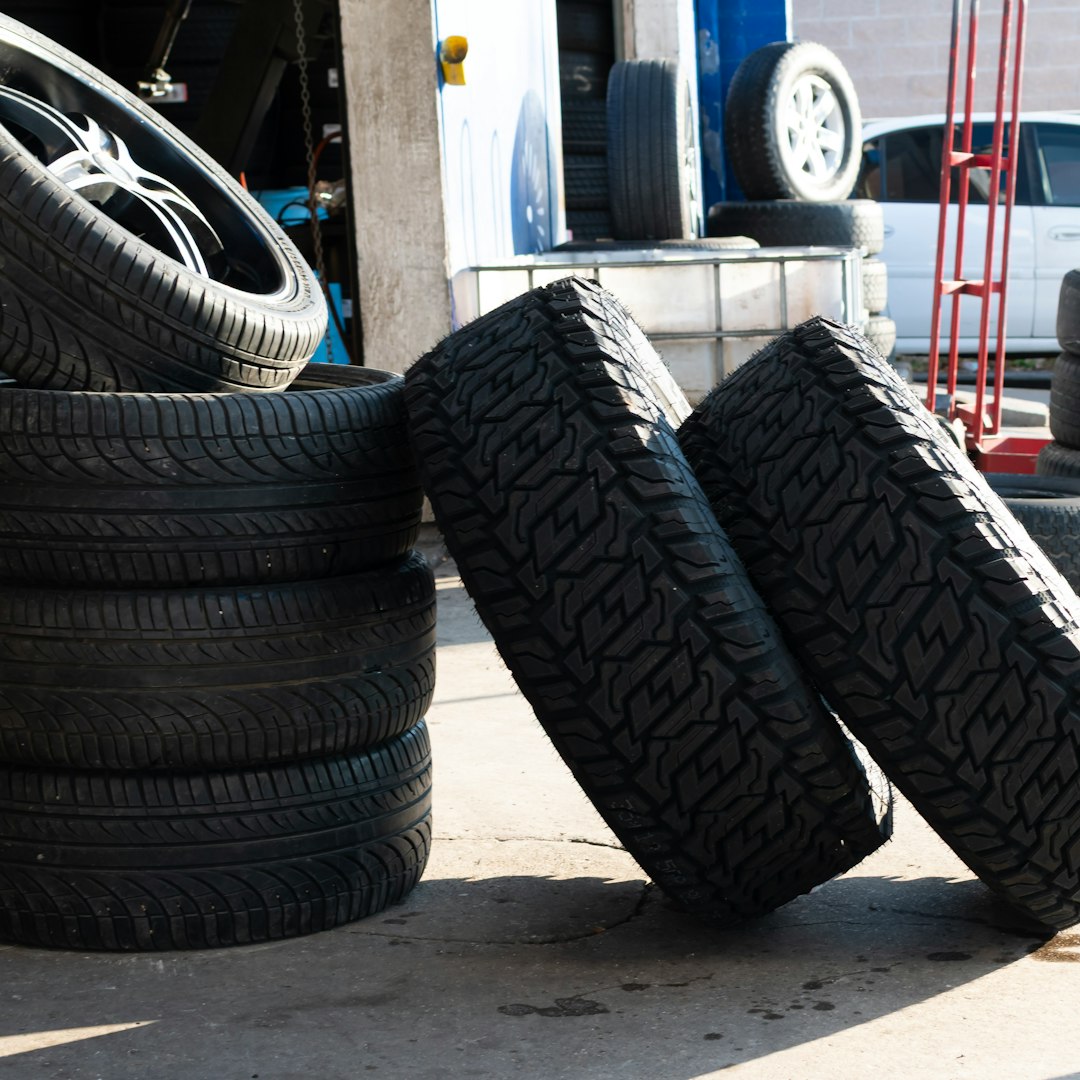 Collection of rubber tires at a tire shop.