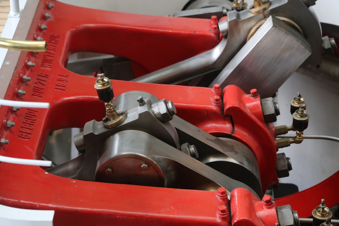 Connecting rods and crank throws of a marine diesel, painted a confident red.
