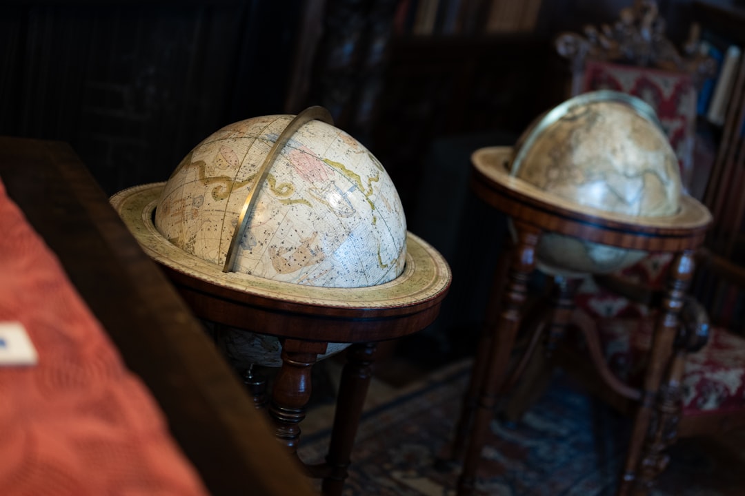 Two library globes on their floor stands, holding the room between them.