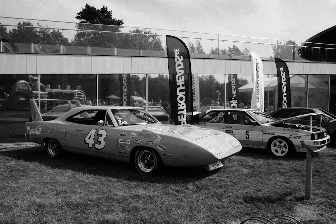 Plymouth Superbird parked on grass.
