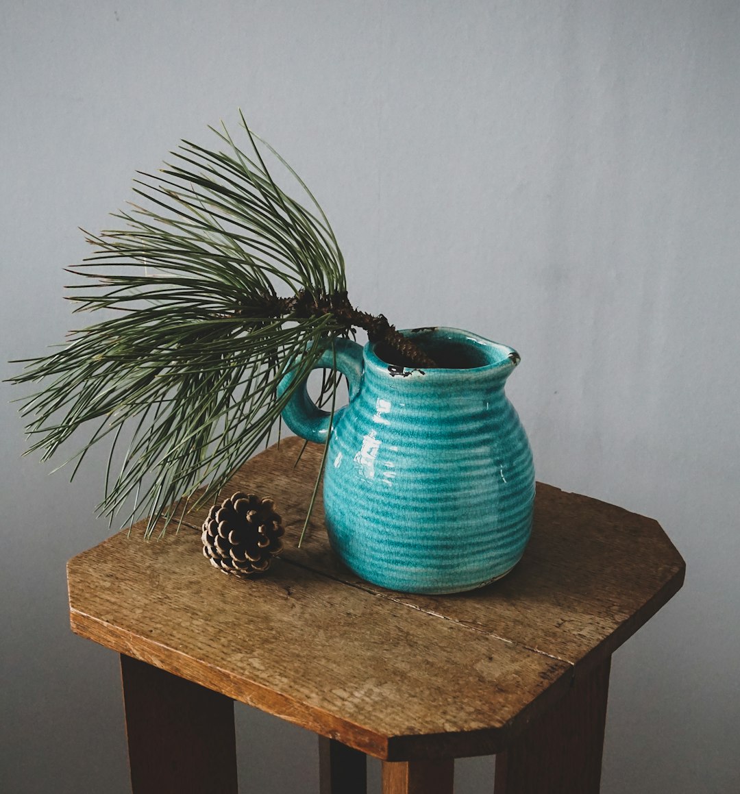 Ceramic water jug on a wooden surface.