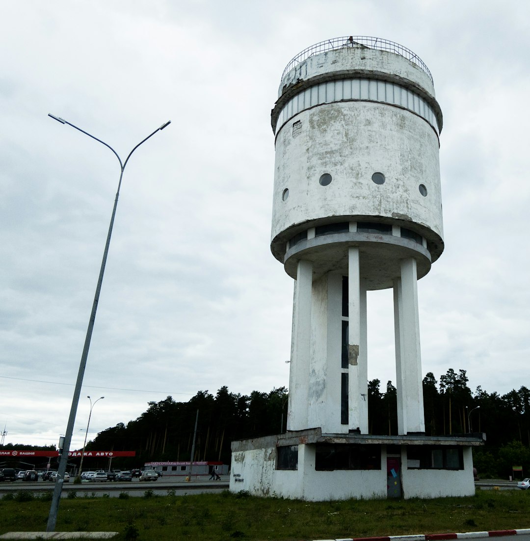 A municipal steel water tower, surveying its domain with regal indifference.