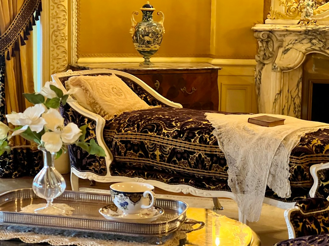 Victorian chaise lounge in a luxurious setting.