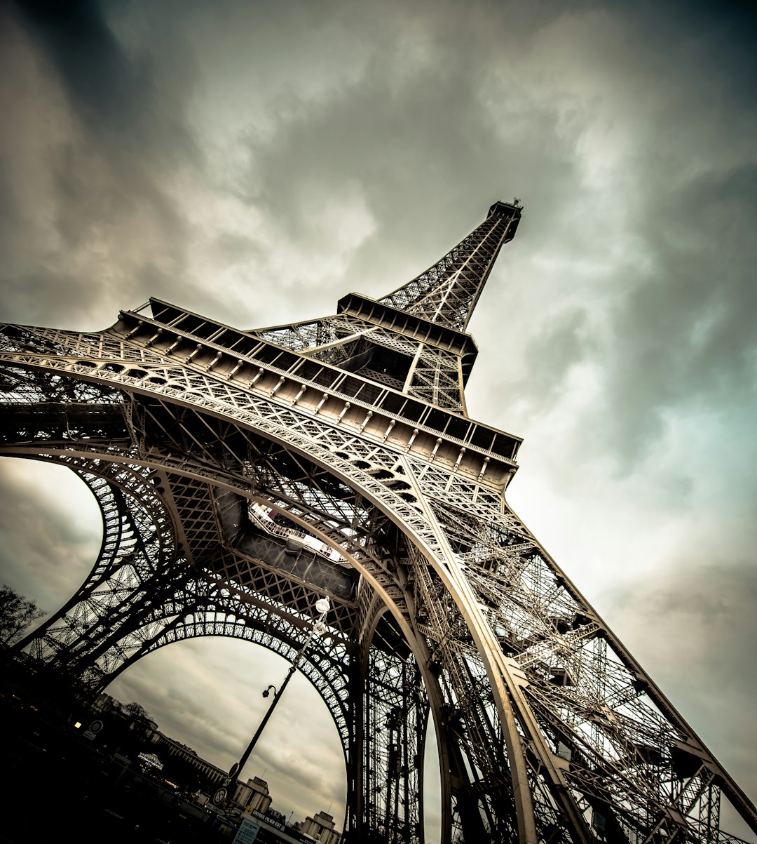 The Iron Lady defending her domain beneath a stormy Parisian sky.