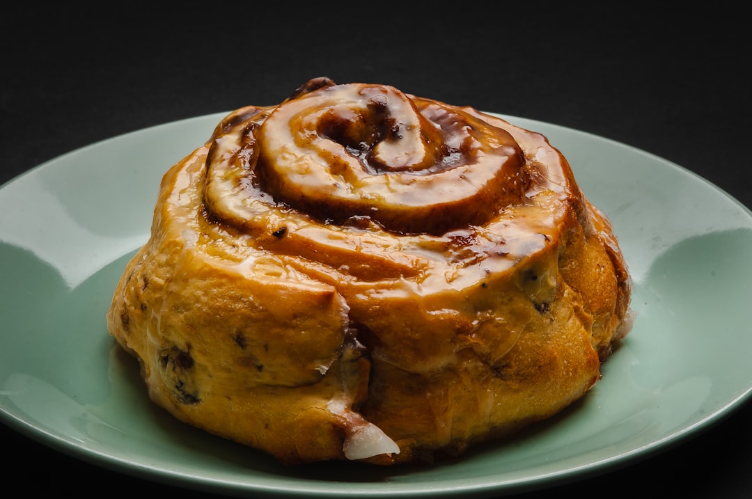 A cinnamon roll of uncommon breadth, viewed with reverence.