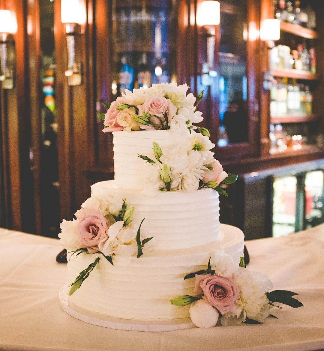 A three-tier wedding cake, ascending to comedic heights.