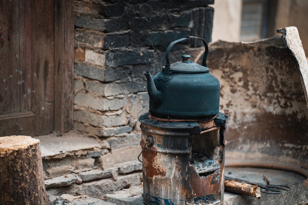 A cast iron tea kettle exuding warmth and weight.