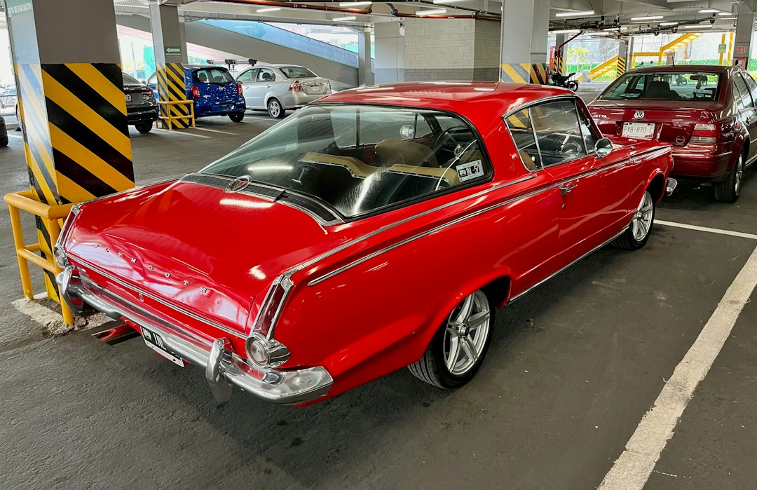 1964 red Plymouth Barracuda.