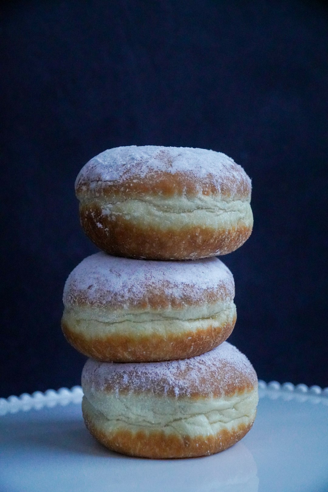 Stack of three paczki.