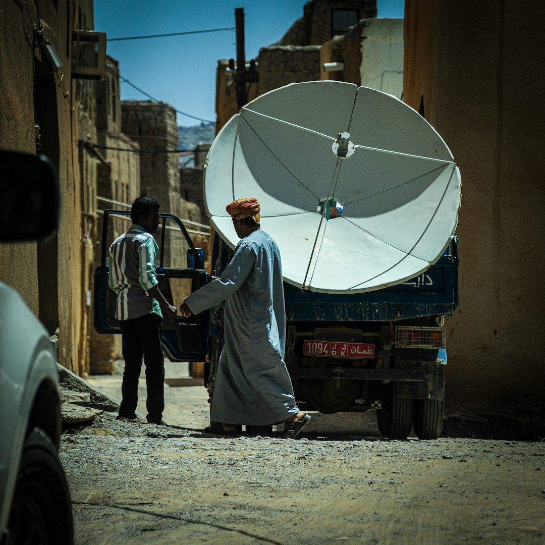 Satellite dish observed in its natural suburban habitat.