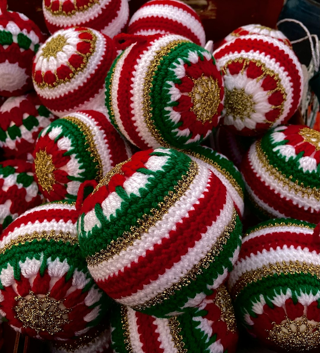 Pile of red and green Christmas baubles.