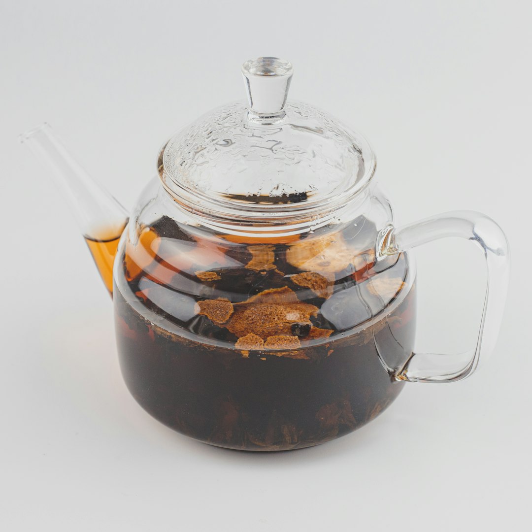 Glass teapot filled with pu-erh tea.