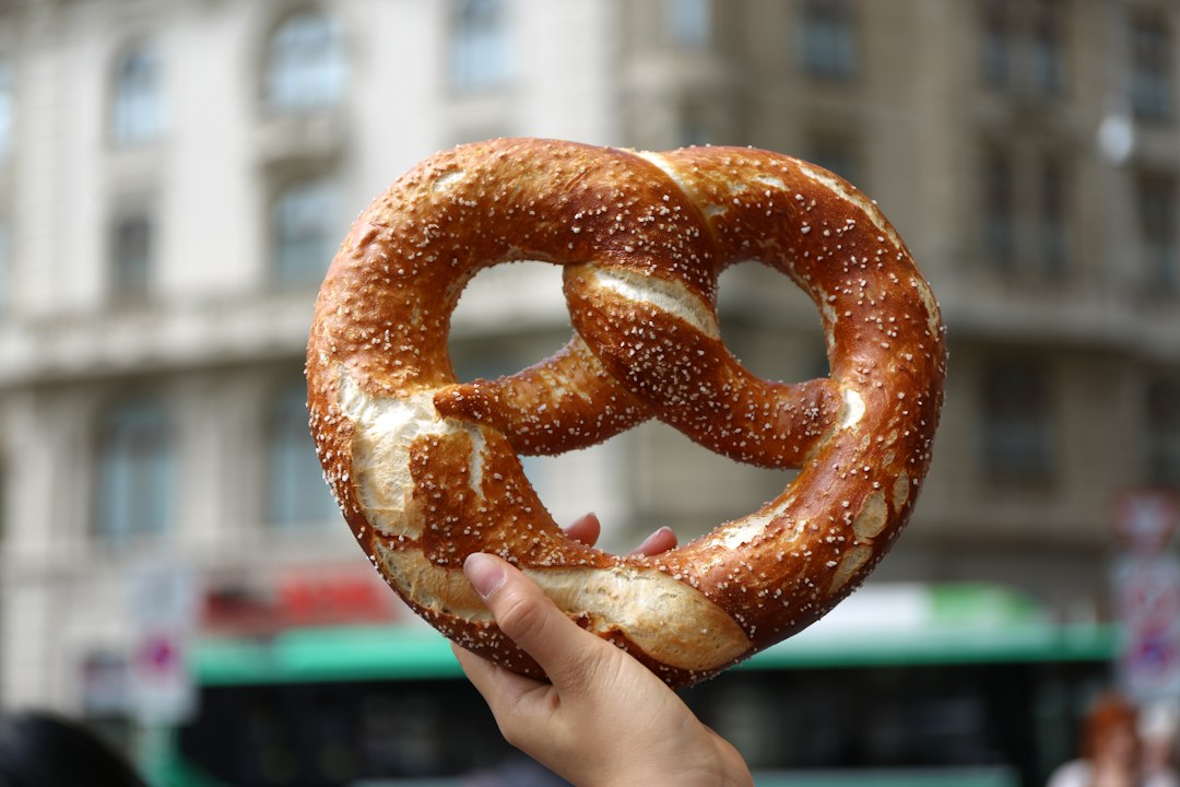 Pretzel held in a hand.