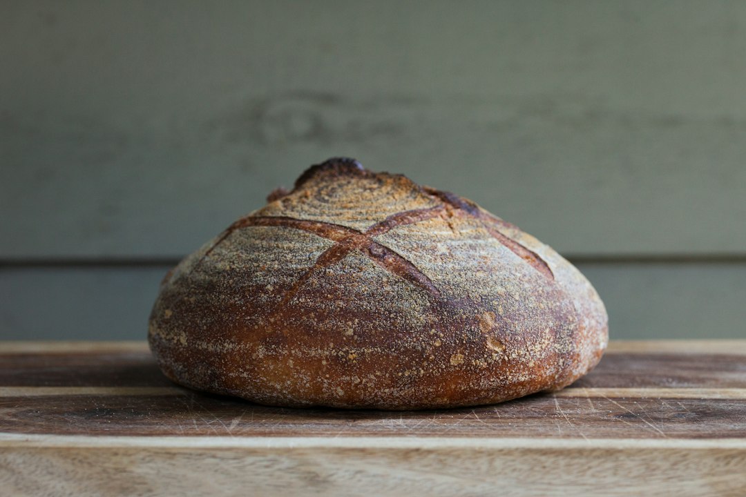 Sourdough boule on a wooden table.