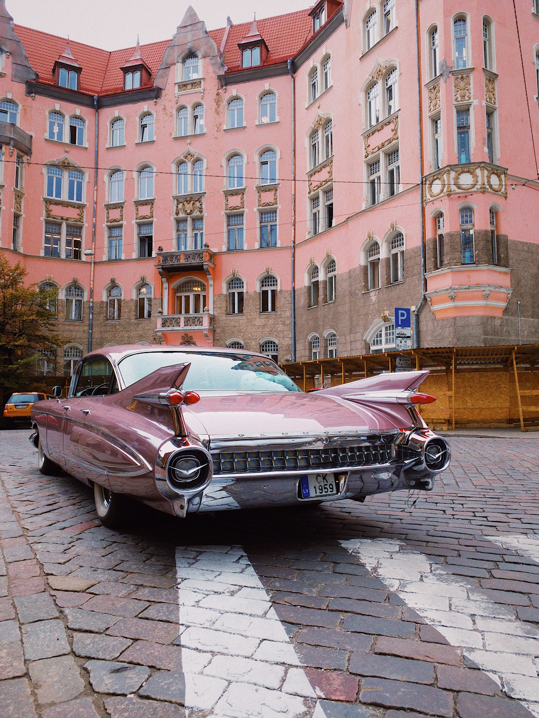 1959 Cadillac parked in a city setting.