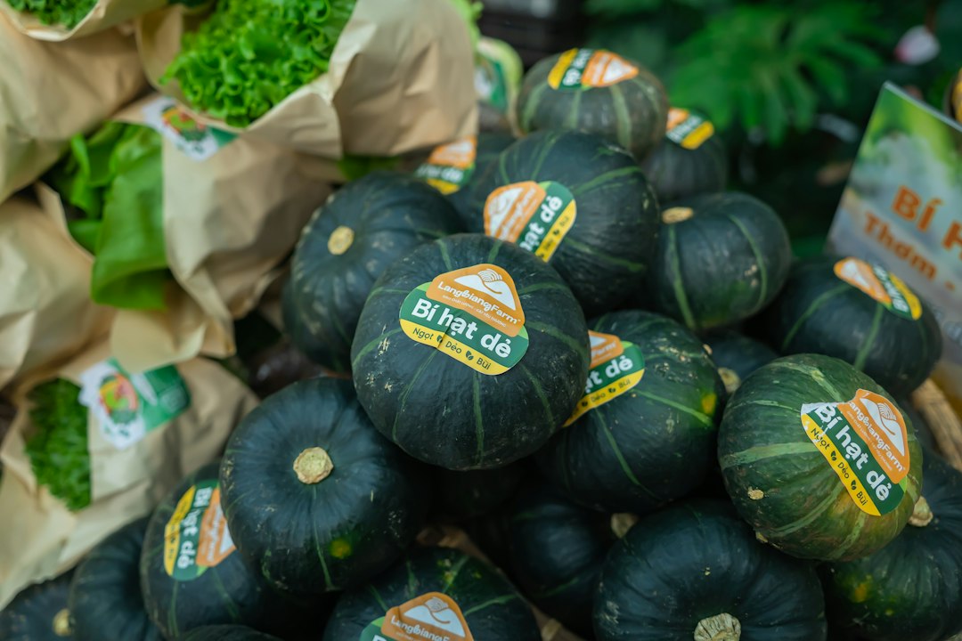 Pile of kabocha pumpkins with labels.