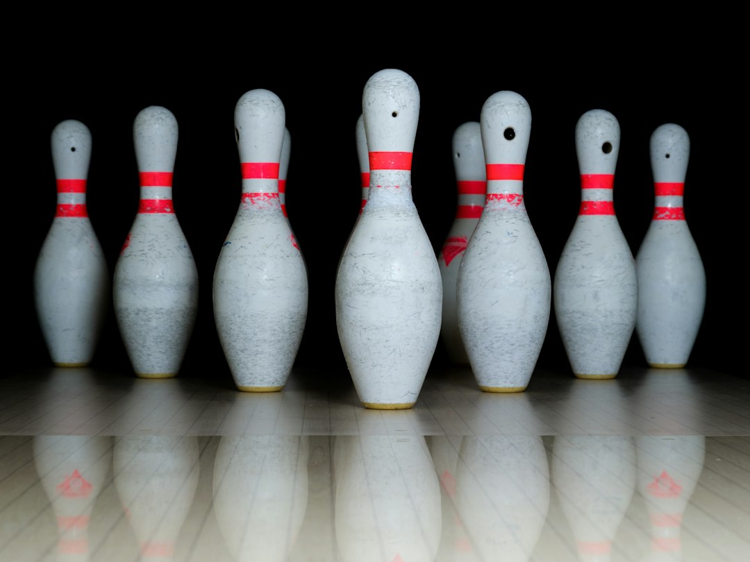 Group of bowling pins arranged on a lane.