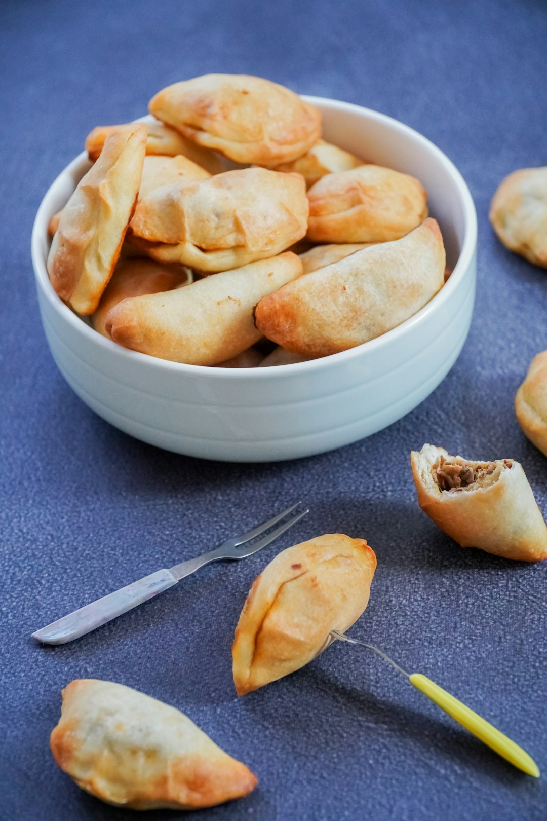 Bowl of baked pierogi.